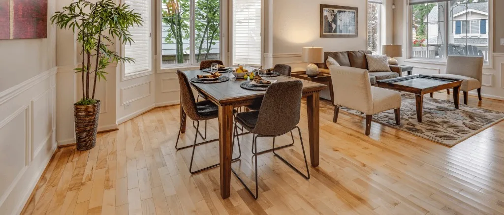 Living and dining room with hardwood plank floors