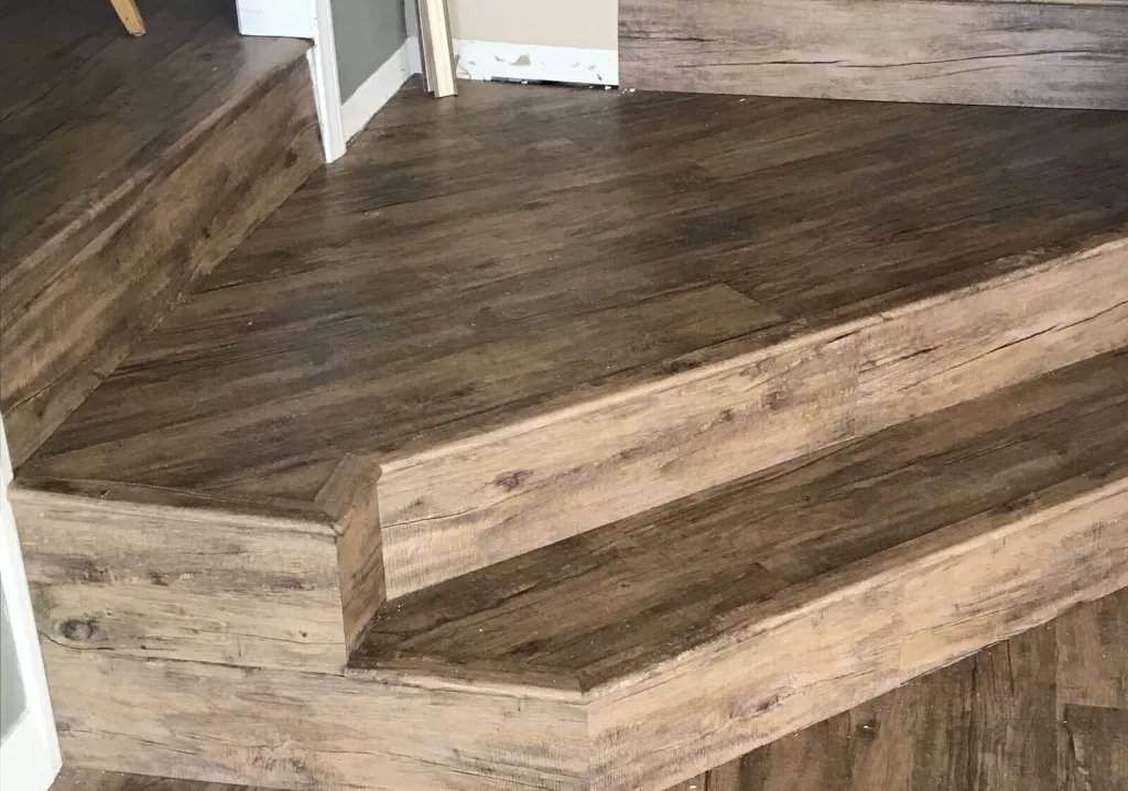 Staircase and landing with rustic wood-look vinyl plank
