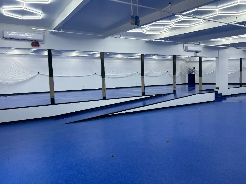 Blue vinyl tile gym floor installation